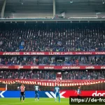 프랑스 리그앙 명문 축구 클럽 - A vibrant stadium scene during a Ligue 1 match in France, showcasing passionate fans in colorful clu...